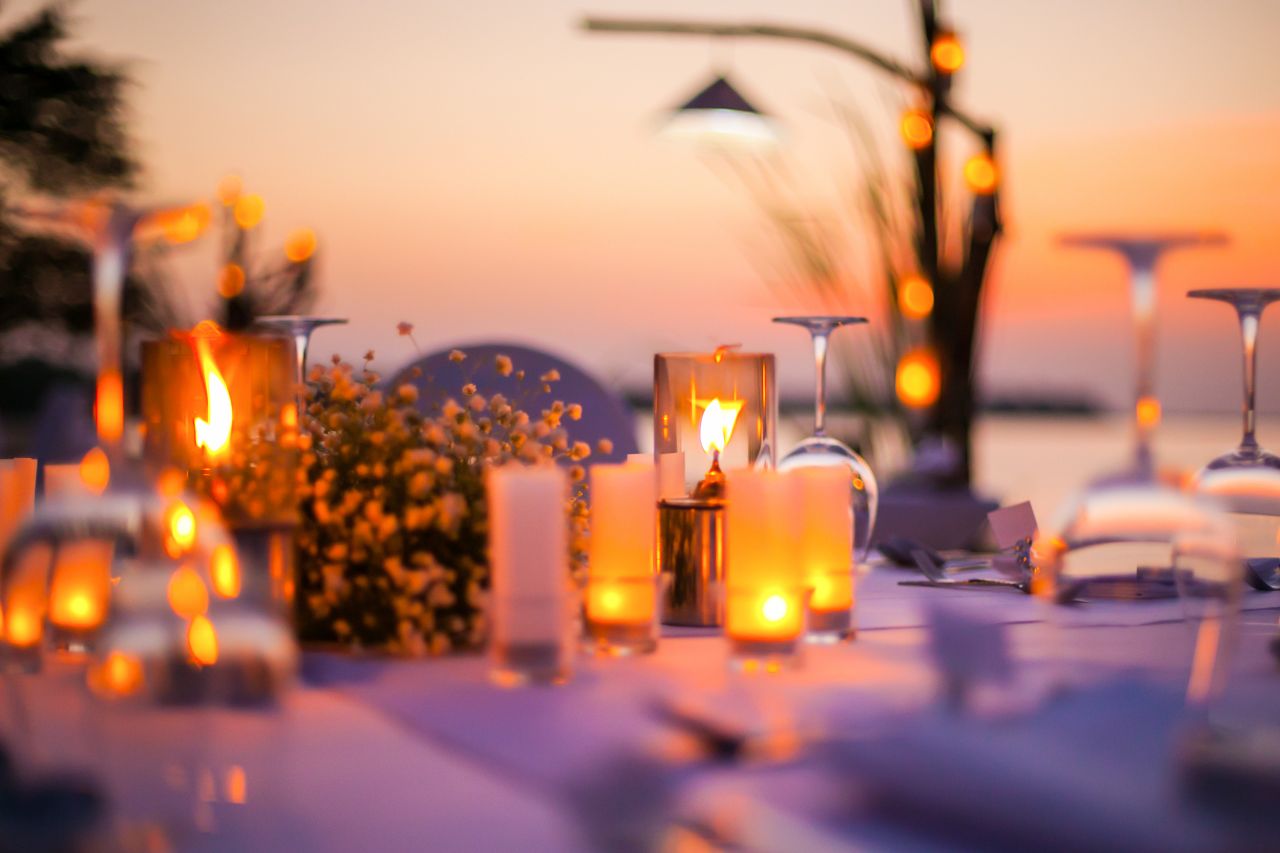 1280 Ambiente Romantic set up dinner set on the beach shutterstock 463396976