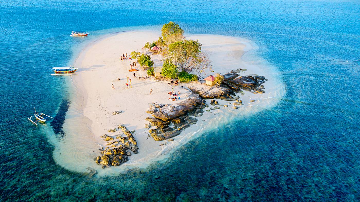 1400 Giri Kedis island with aquamarine water in Lombok shutterstock 1165035151