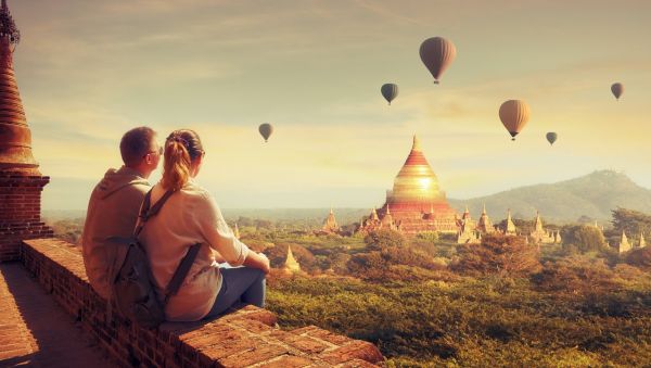 1280 Happy tourists friends enjoy watching the flight of balloons over the old Bagan in Myanmar. shutterstock 1299350458
